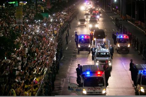 A huge crowd of Filipino faithful gather in excitement along Roxas Boulevard in Manila, Philippines, as they welcome the motorcade of Pope Francis…